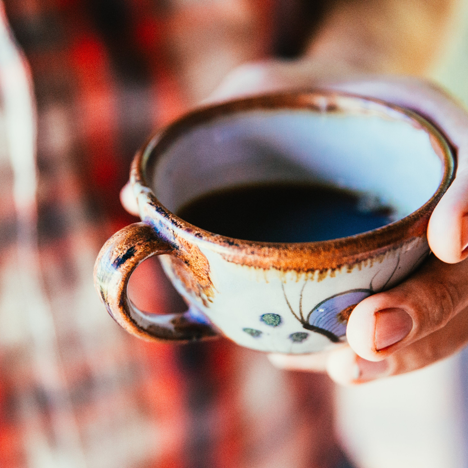 Country Home & Garden Collection at GravelChic, Someone in a Plaid Shirt Holding a Ceramic Cup of Coffee, photo by Brodie