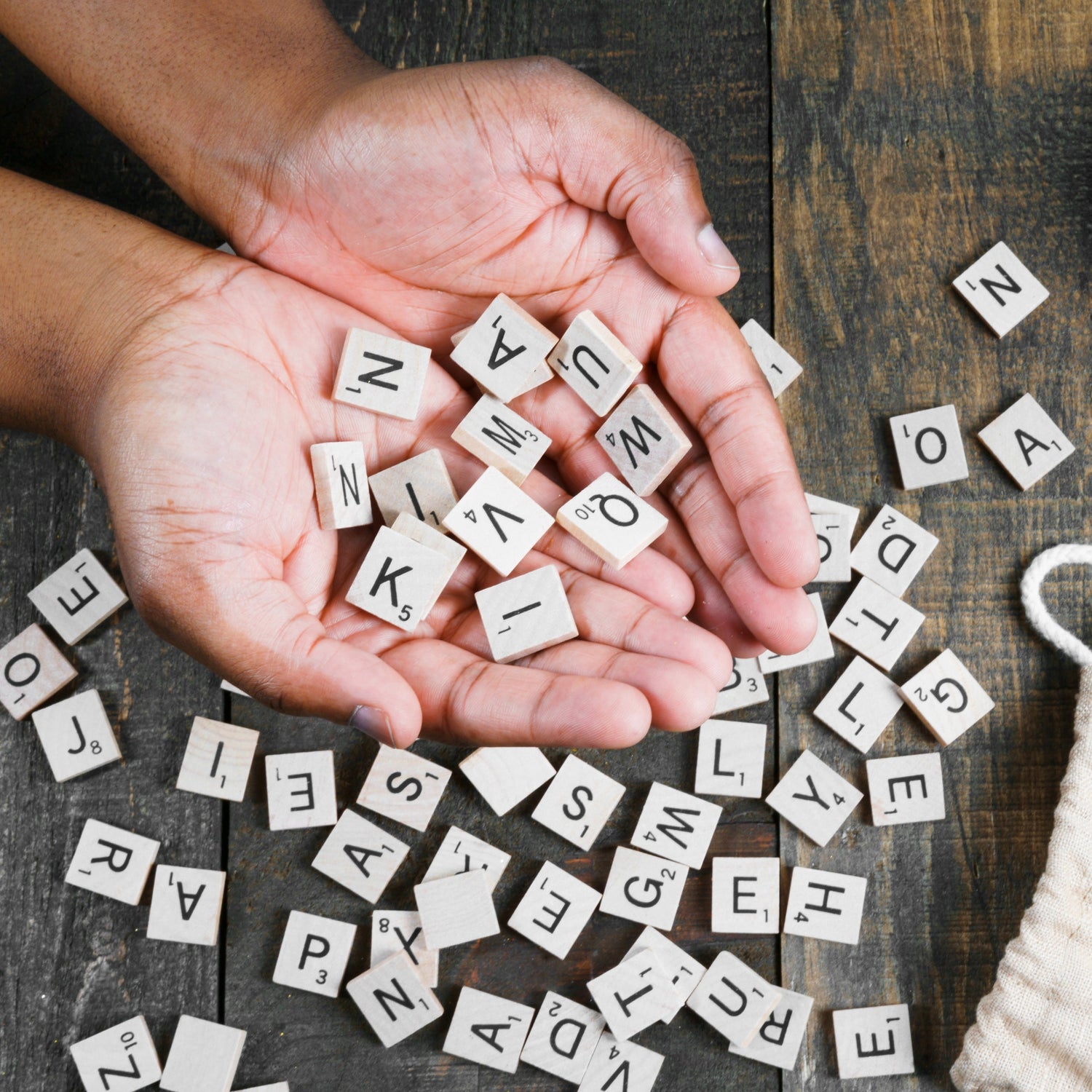 Country Hobbies & Fun Collection Cover Photo at Gravel Chic, Hands Holding Wooden Alphabet Tiles