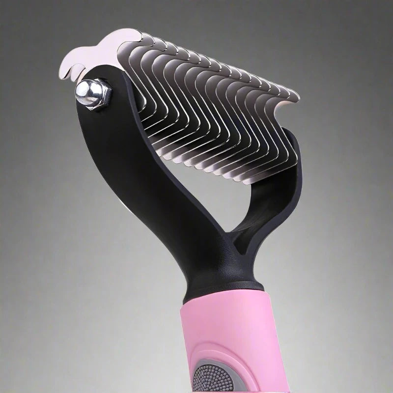 pink handle claw-toothed dog grooming device