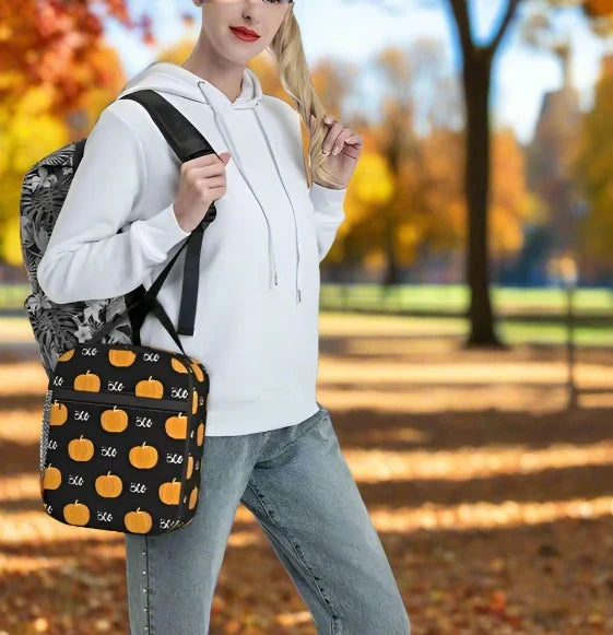 Pumpkin Boo print lunch bag carried by woman in autumn park